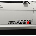Set Stickere auto caroserie Powered by Audi, scris alb, 2buc